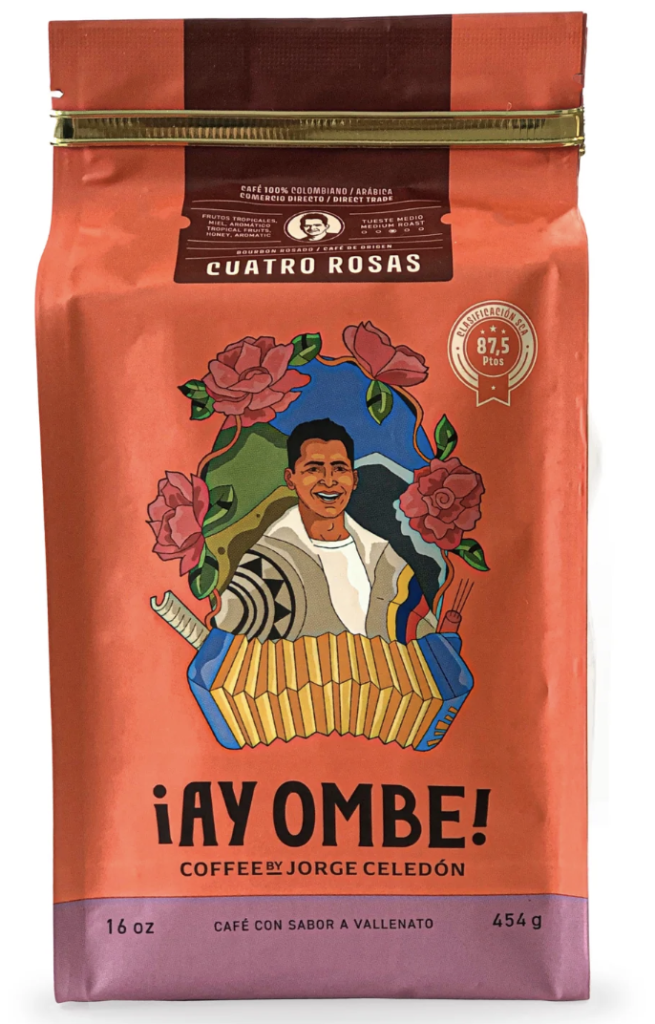 Empaque de café "Cuatro Rosas" de la marca Ay Ombe Coffee by Jorge Celedón, destacando la ilustración del artista con un acordeón y elementos del folclor.